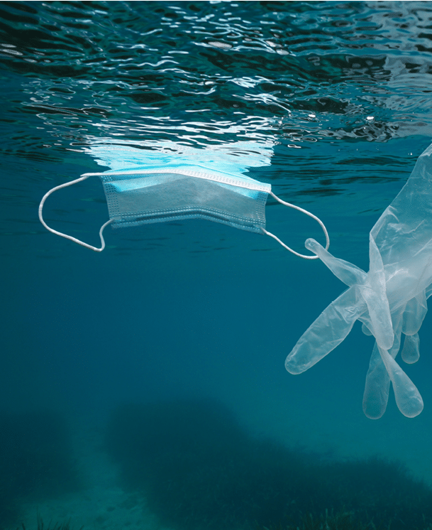 Face mask and glove in the sea, plastic waste pollution underwater since coronavirus COVID-19 pandemic, Mediterranean sea, France
